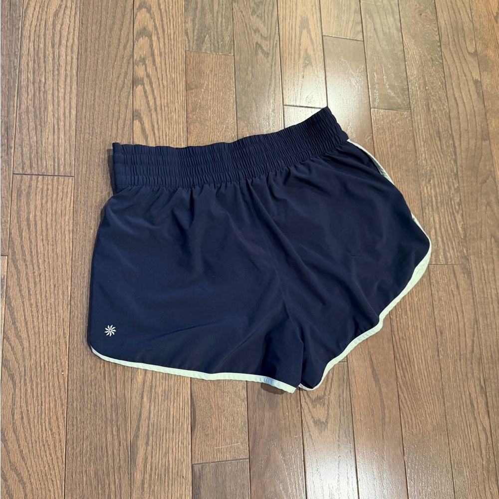 Athleta Weekender high rise 3” Navy Shorts with lime green Trim - Picture 2 of 4